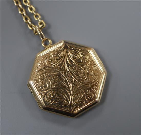 A 9ct engraved gold octagonal enclosed locket on a 375 oval link chain, gross 9.2 grams.